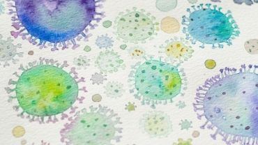 Sini- ja vihreäsävyisiä vesivärein piirrettyjä koronaviruksia.